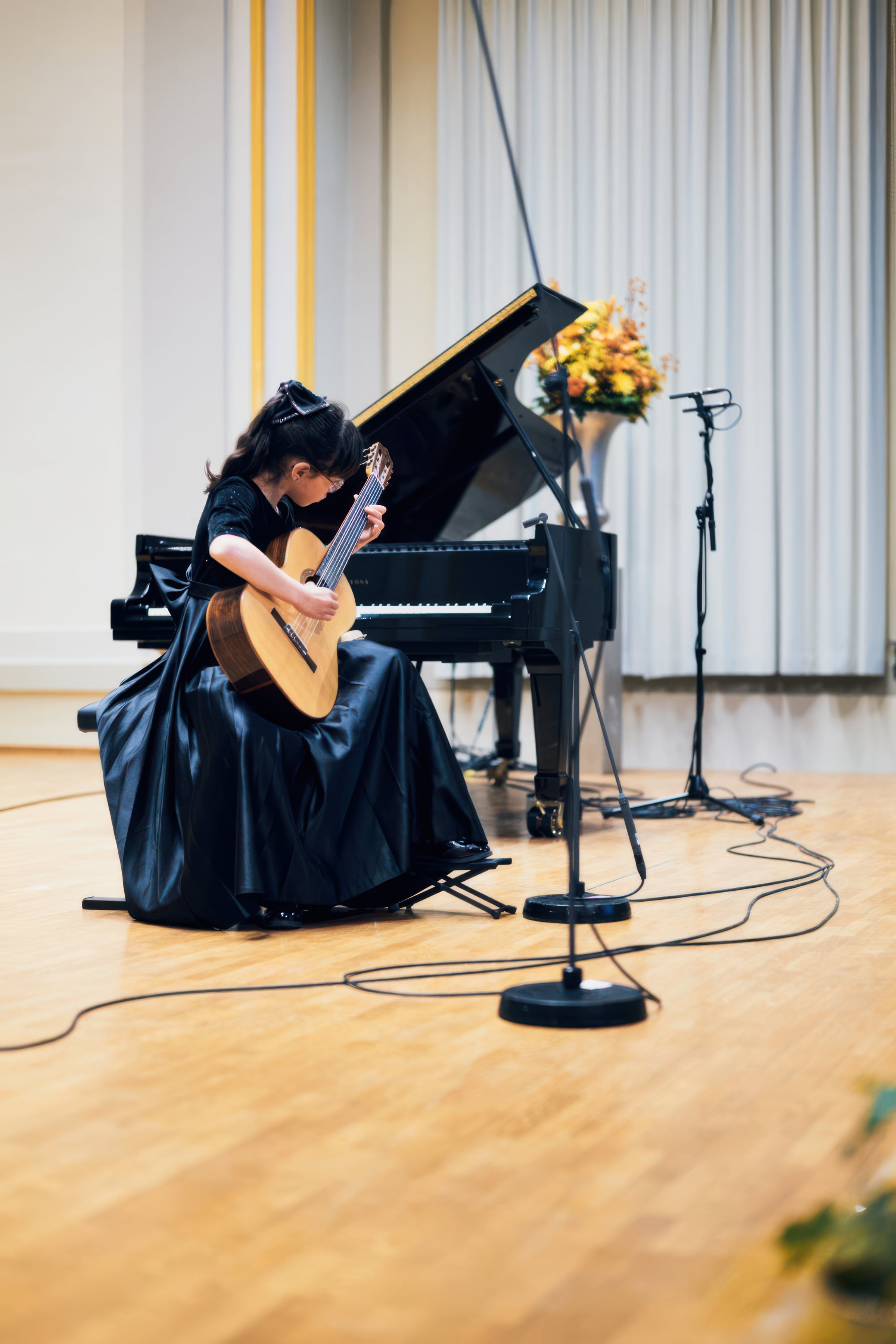 A classical guitarist on stage.