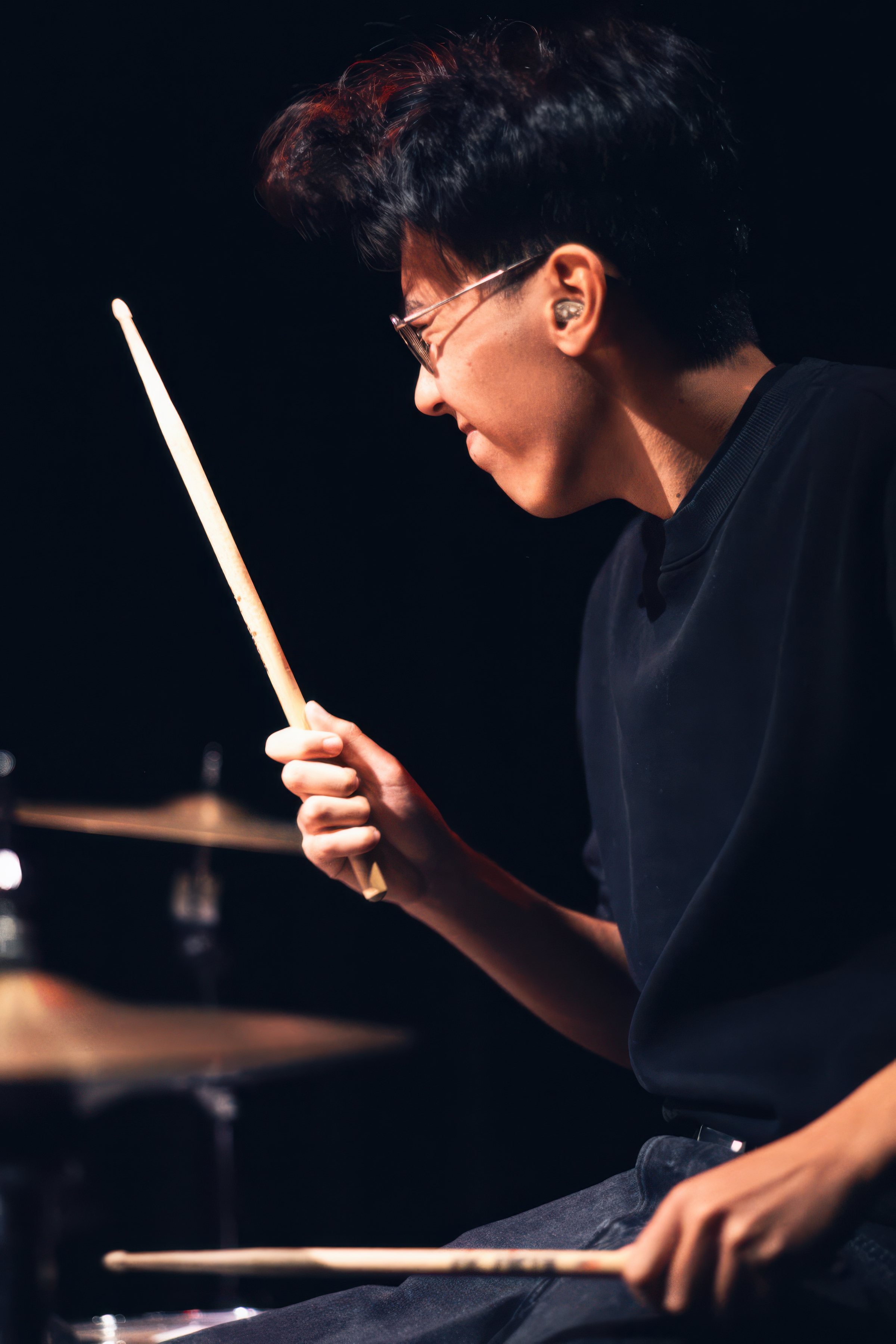 A drummer at the drum kit.